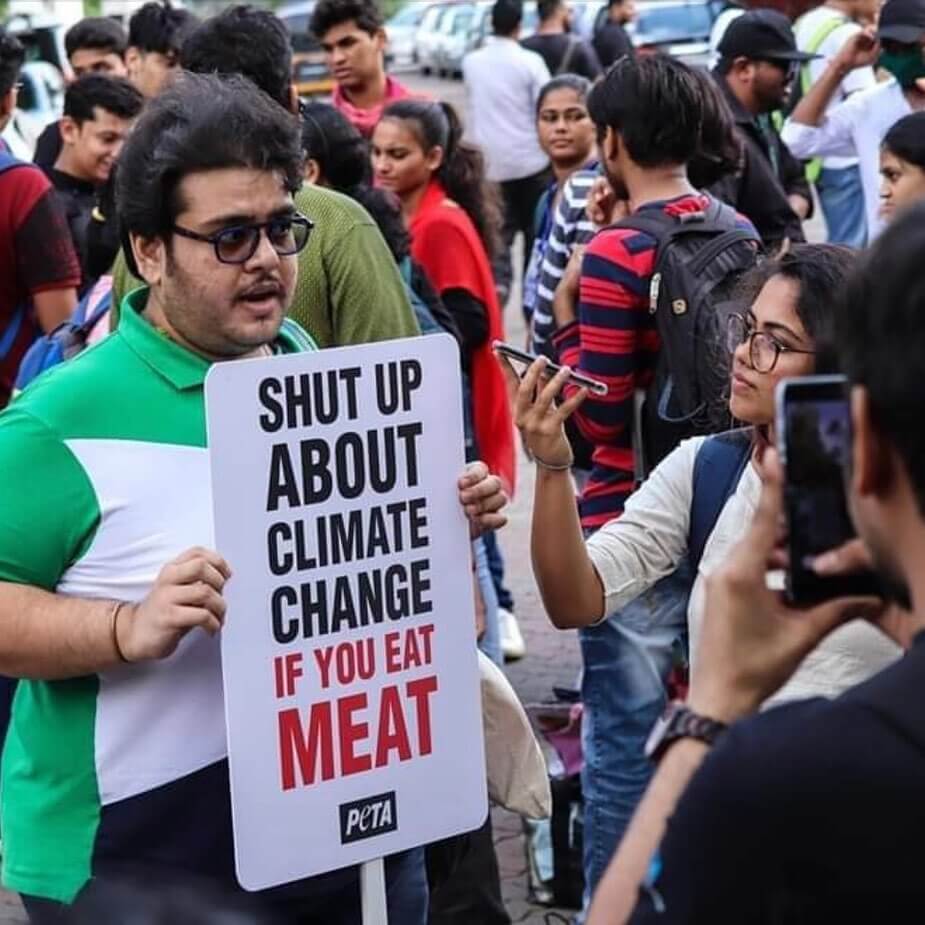 https://headlines.peta.org/wp-content/uploads/2019/12/climate-change-eat-meat-sign-peta-best-photos-2019.jpg