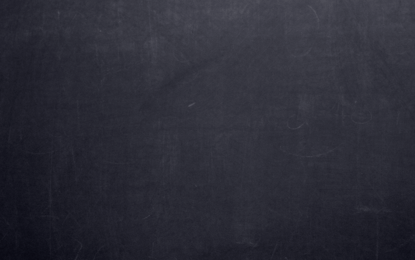 A blank dark grey chalkboard