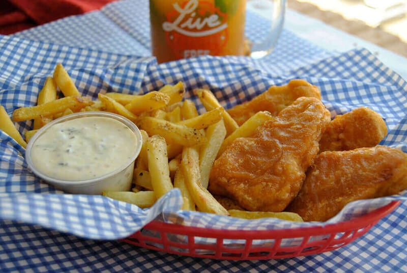 Gardein vegan fish fillets, fries, and vegan tartar sauce in a basket