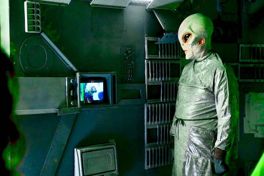 An aliens watching a monkey be experimented on in PETA’s new virtual reality experience Abduction.