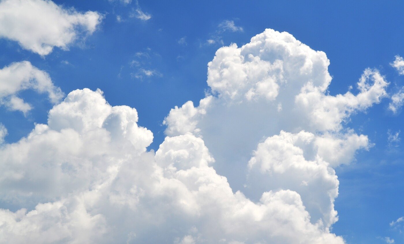 White clouds floating in a bright blue sky