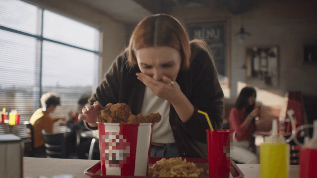 https://headlines.peta.org/wp-content/uploads/2022/12/woman-spitting-out-chicken-in-never-go-vegan-ad-1024x576.png