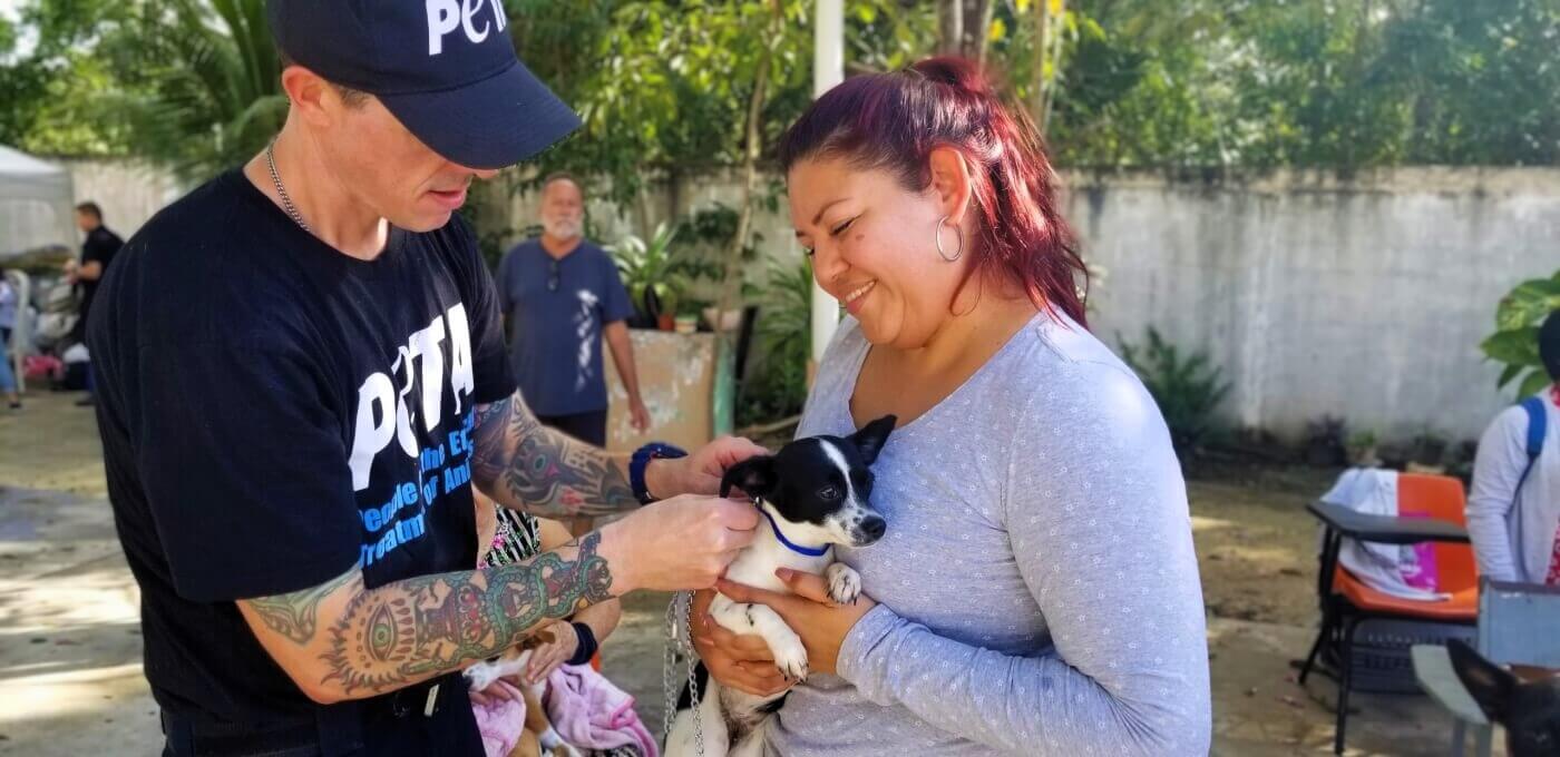 PETA staffer and woman with her dog at Cancun spay-a-thon
