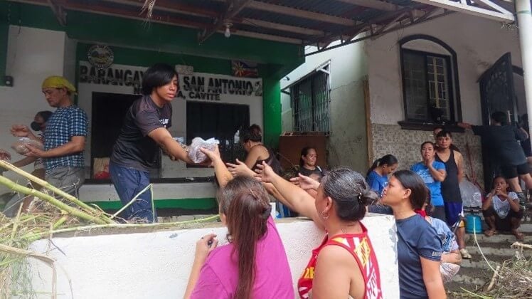 Volunteers handing out supplies