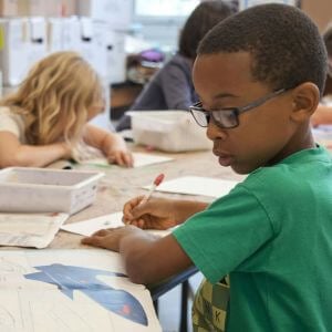 Student looking at a workbook