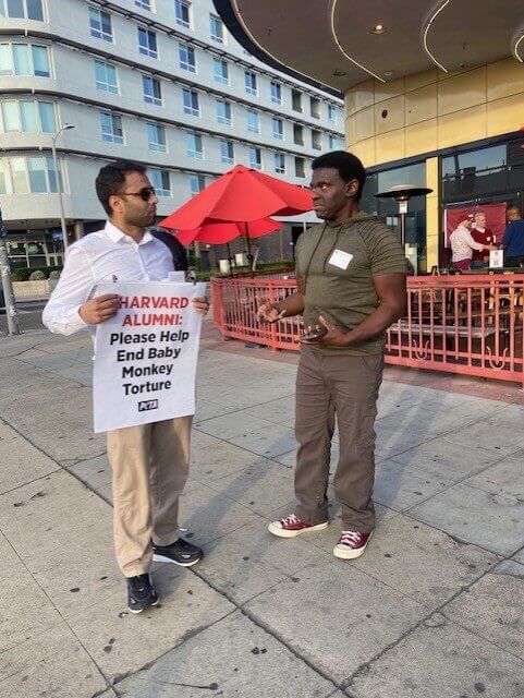An activist speaking with a passerby