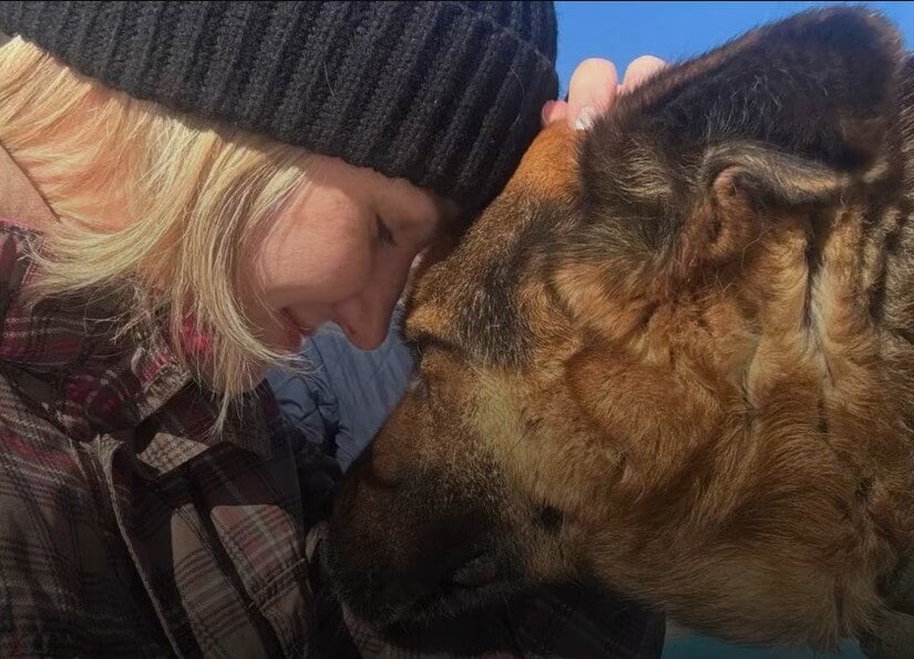 Woman reuniting with dog
