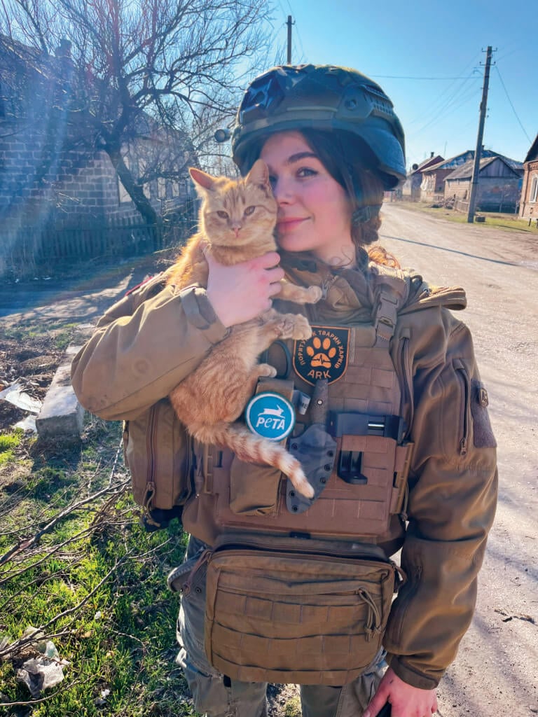 Rescuer holding cat