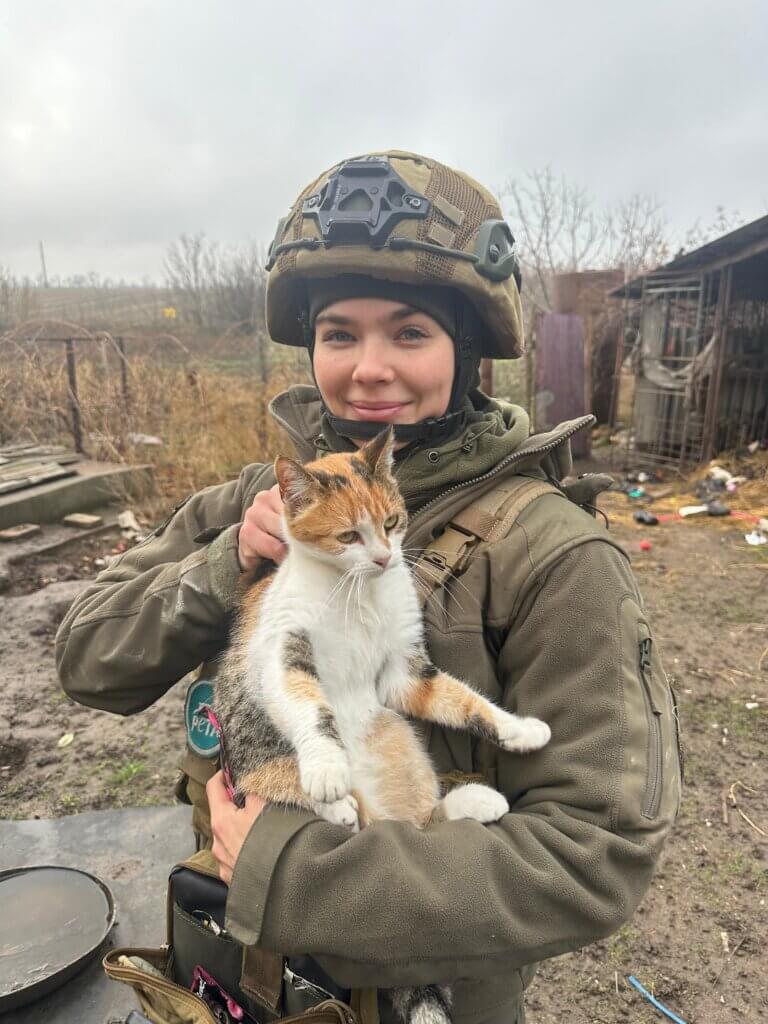 Rescuer holding cat