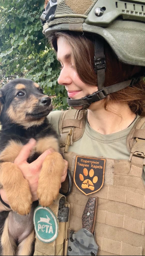 Rescuer holding puppy