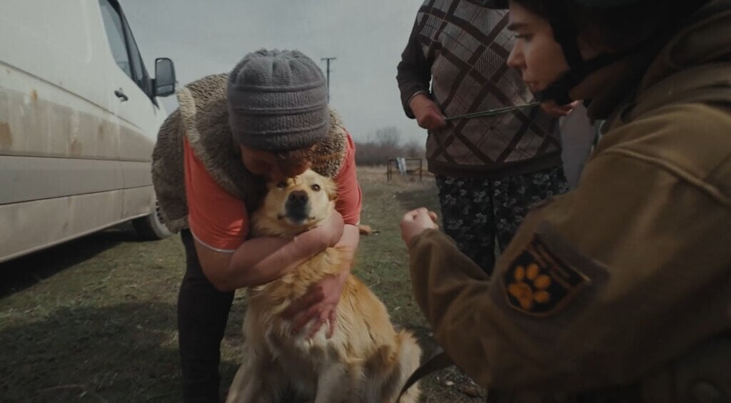 Woman hugging dog